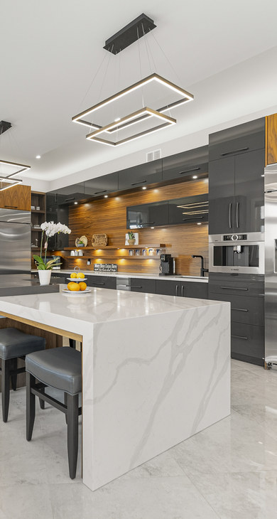 Modern kitchen with walnut cabinetry and a marble waterfall island